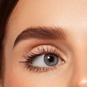 A Close Up Of A Person With Blue Eyes