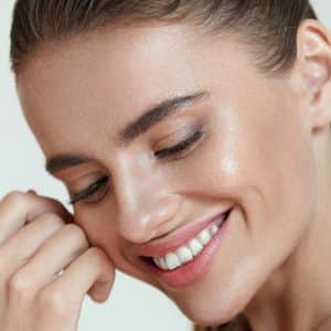 A Close Up Of A Person Talking On A Cell Phone