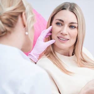 A Couple Of People Posing For The Camera