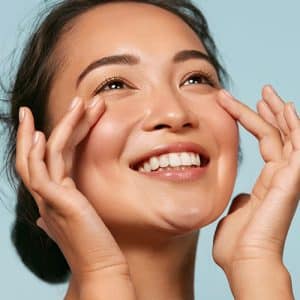 A Woman Smiling And Talking On The Phone