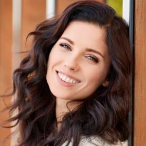 A Woman Smiling For The Camera