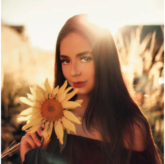 a woman holding a flower