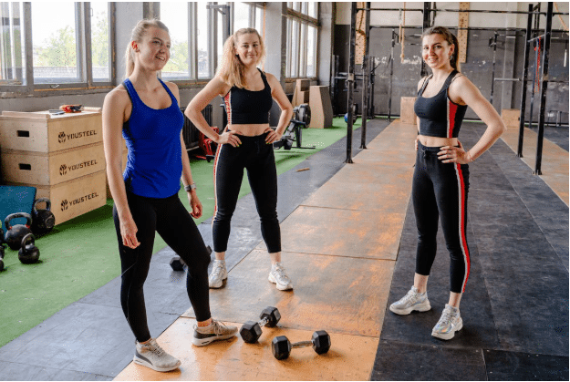 a group of people walking on a sidewalk